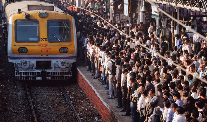 Local Train Arrives at the Station During Rush Hour